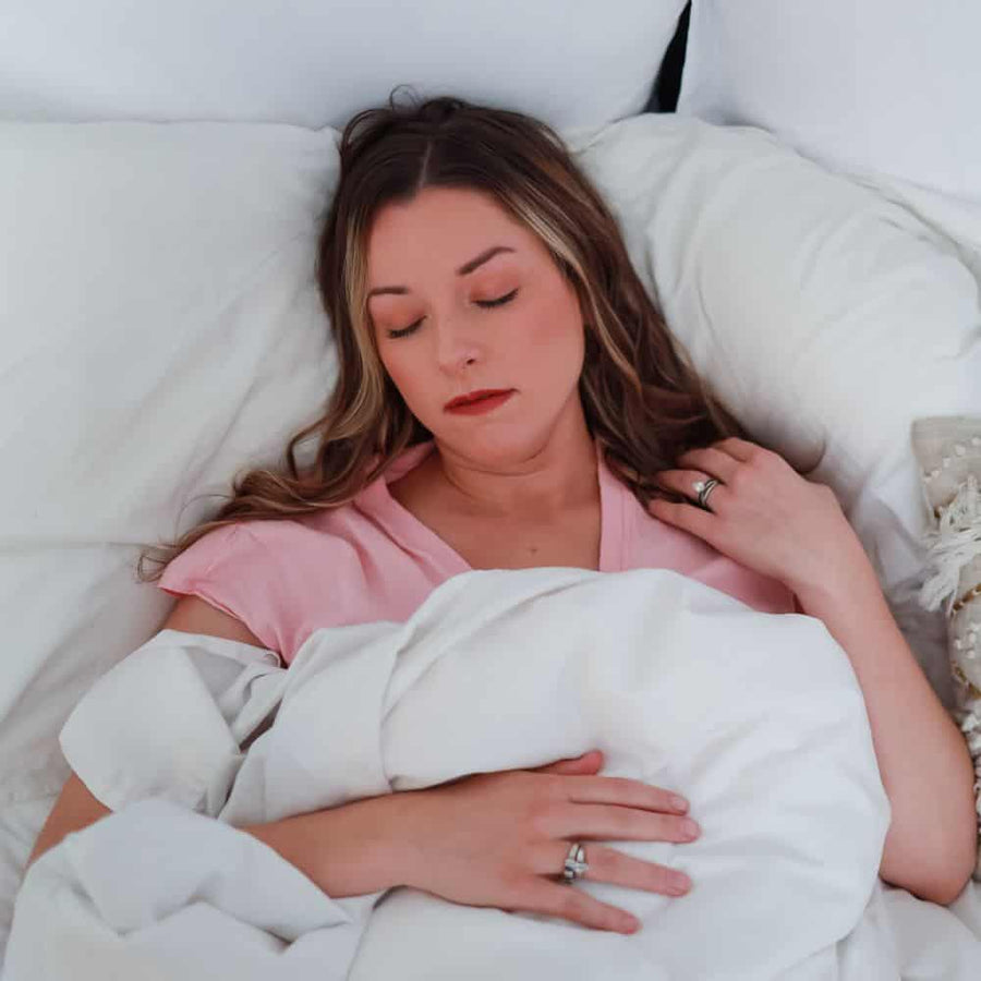 Woman Peacefully Sleeping after taking CBD Sleep Gummies